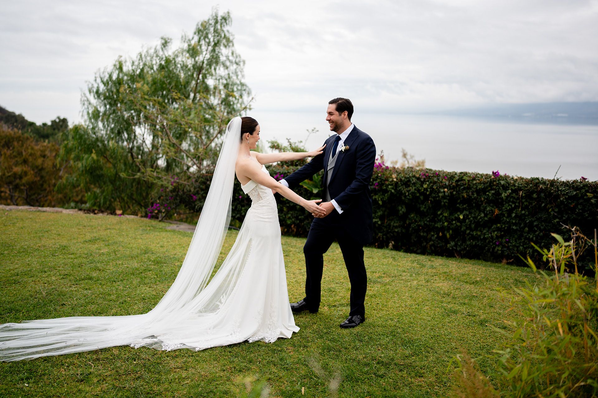 Couple laughing together on the lawn, Lake Chapala, Jalisco